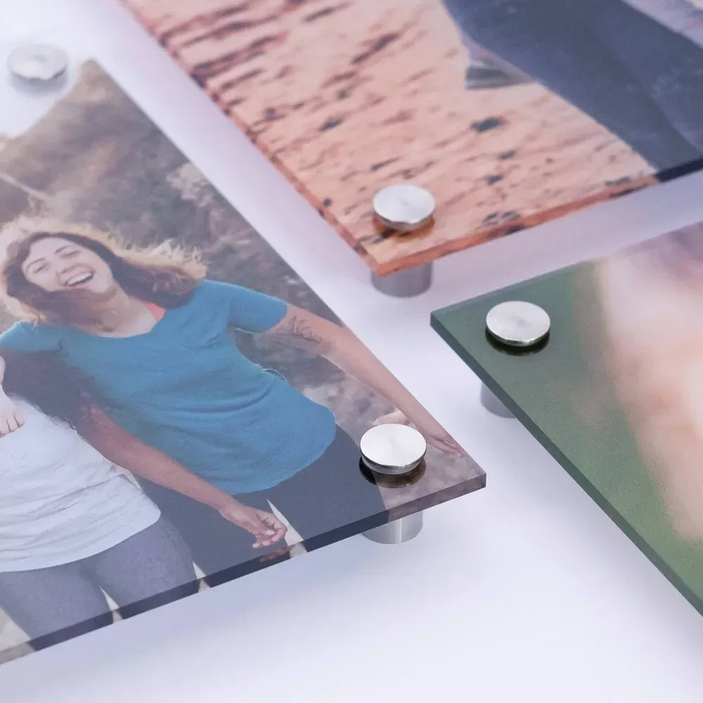 Four overlapping acrylic print corners showing photos, thickness and standoffs