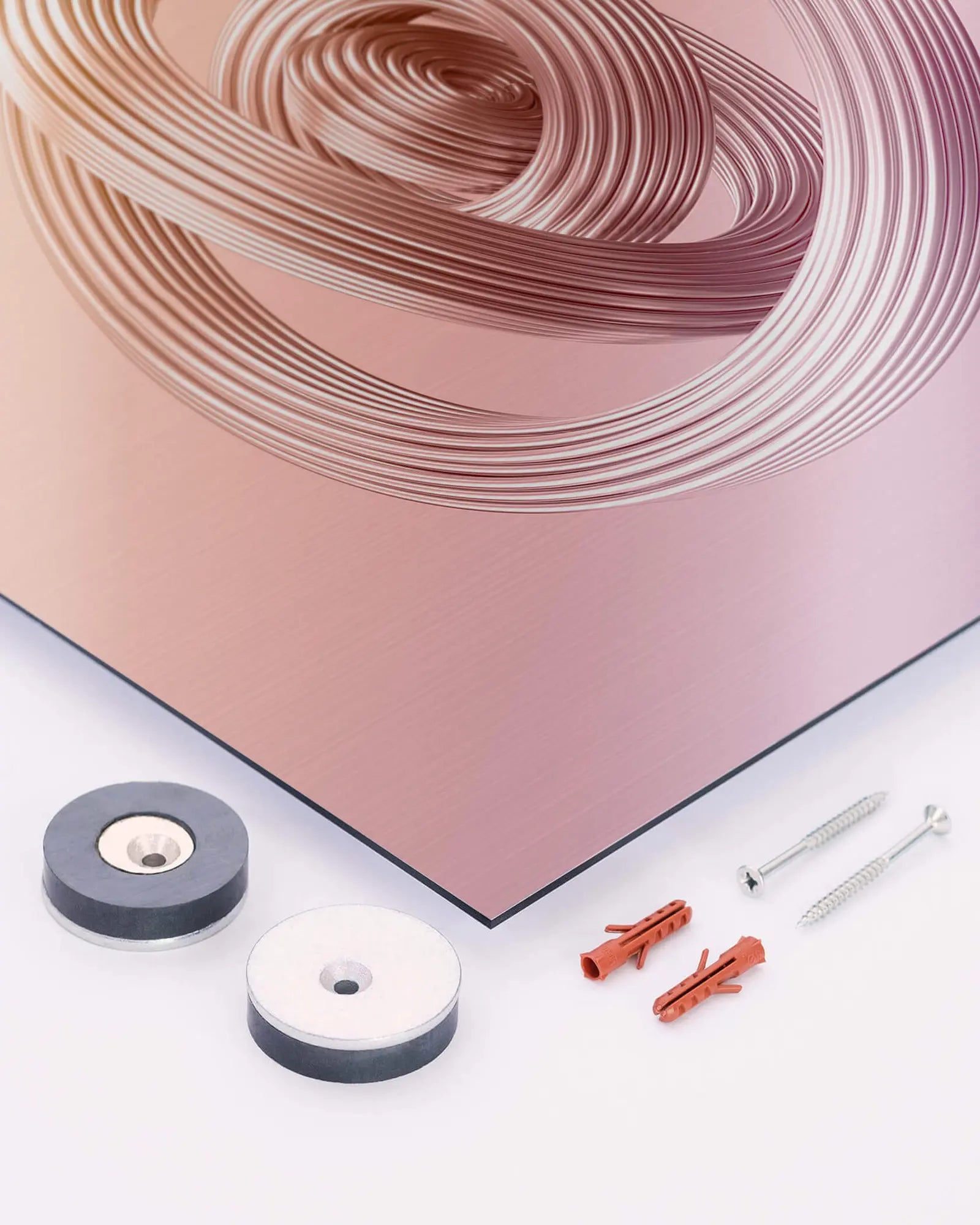 Corner of a metallic print with magnetic hanging discs, screws and wall plugs