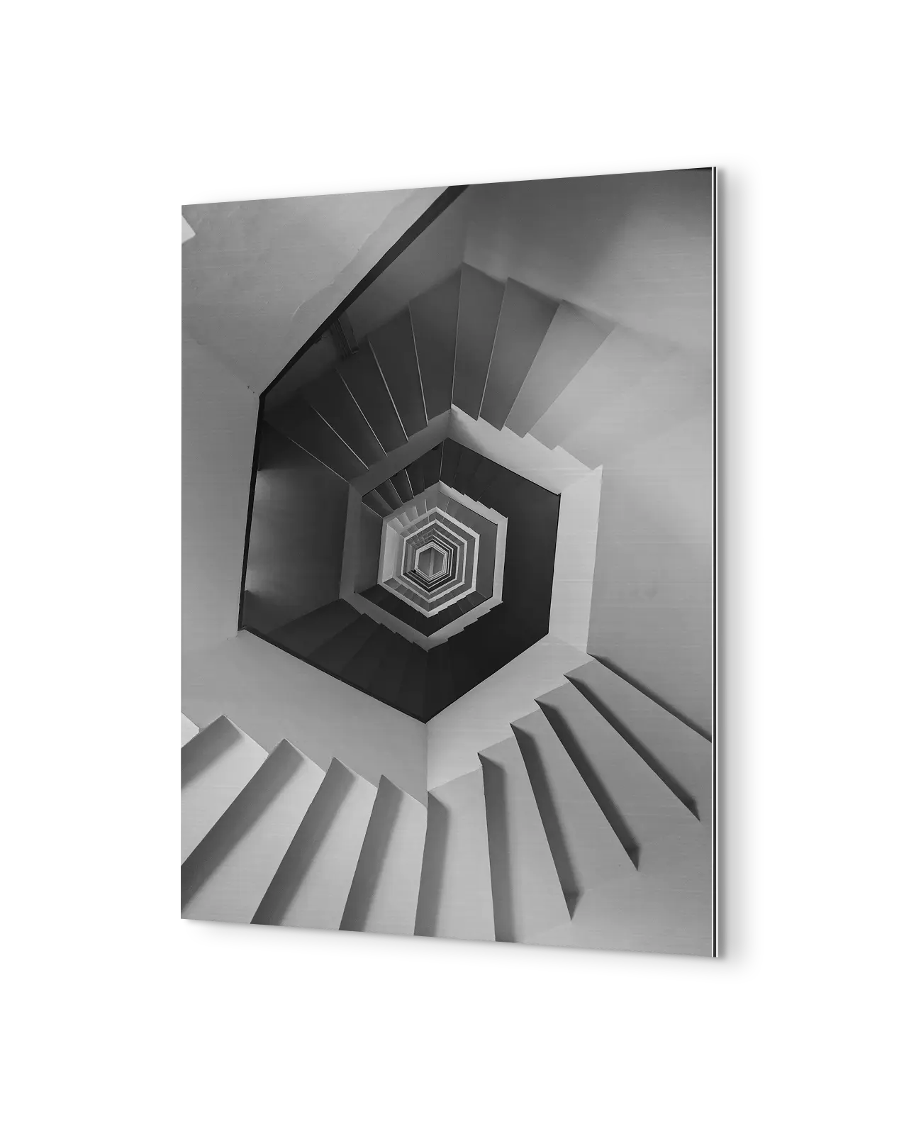 Angled aluminium print on a black background showing the thin panel edge