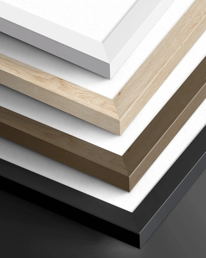 Four stacked wooden frame corners in white, natural wood, dark wood and black