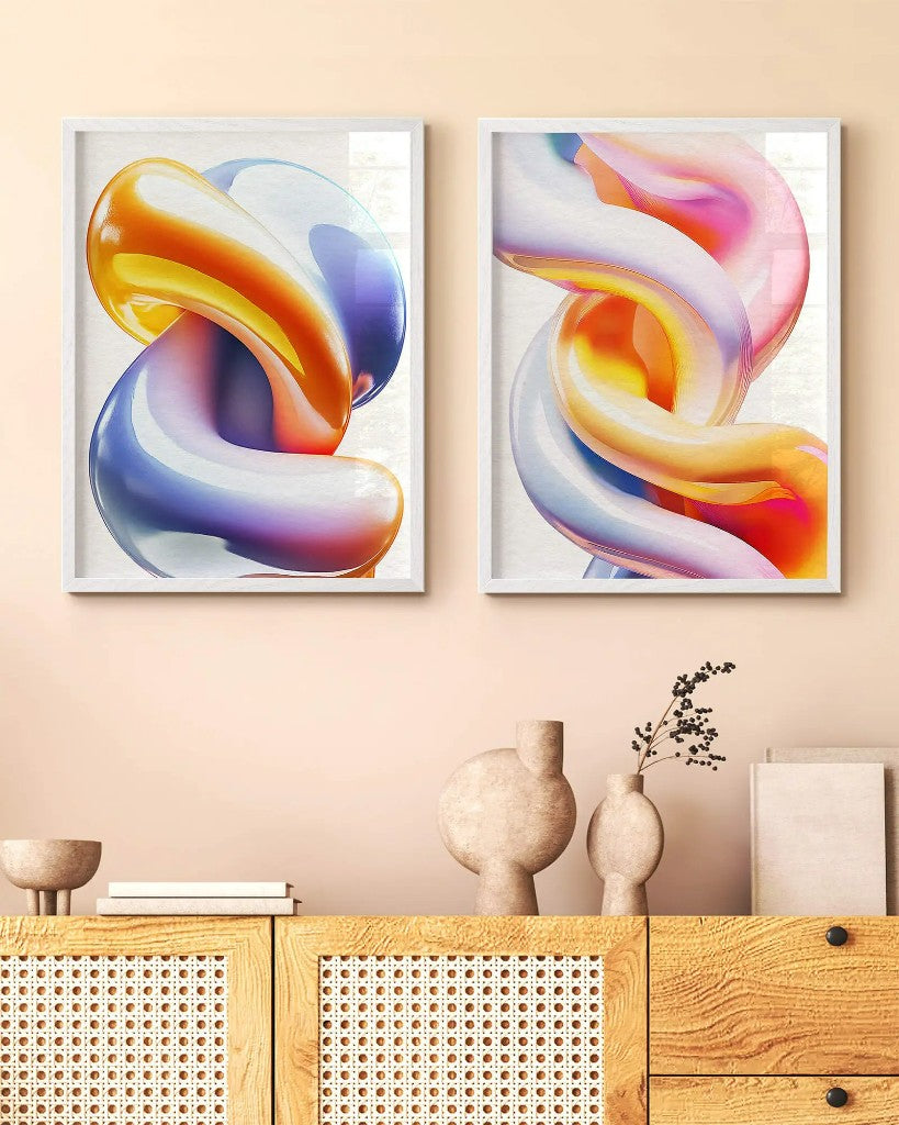 Two fine art framed posters hung above a wooden console table
