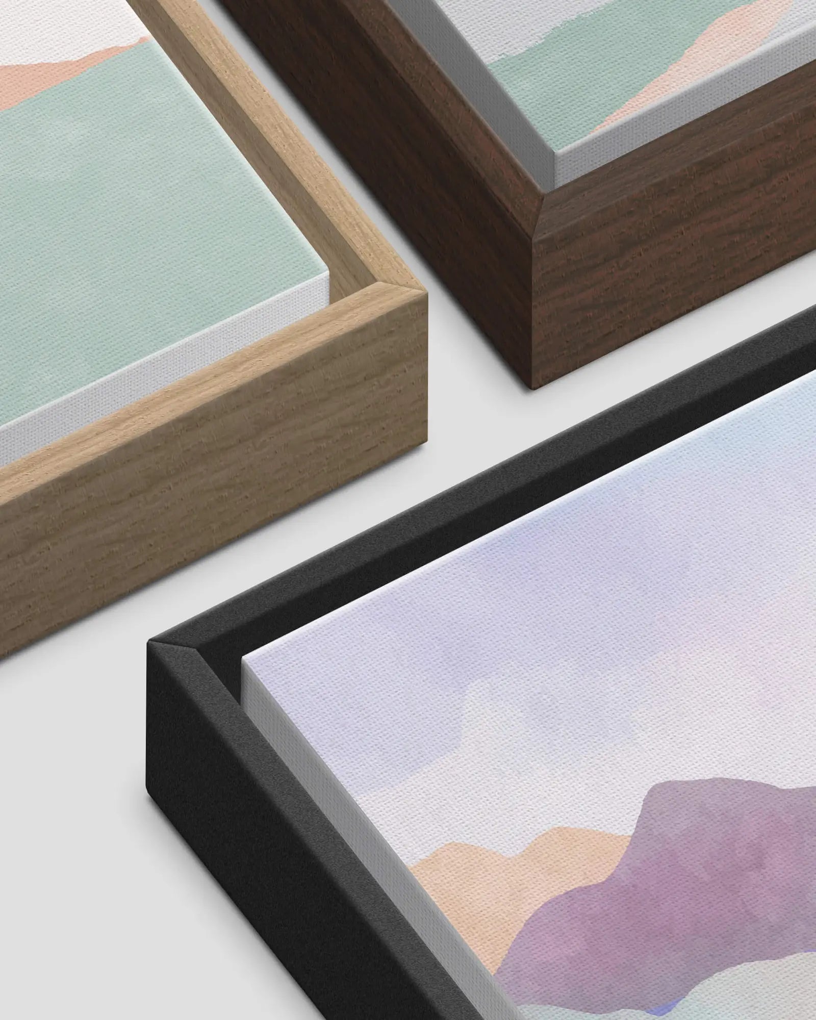 Close-up of natural wood, dark wood and black floating frames