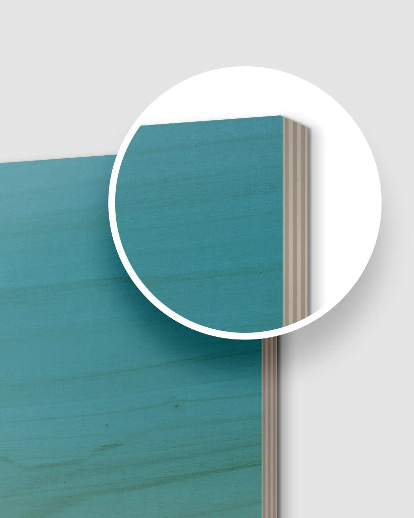 Close-up of a wood print corner with a magnified view of the layered plywood edge