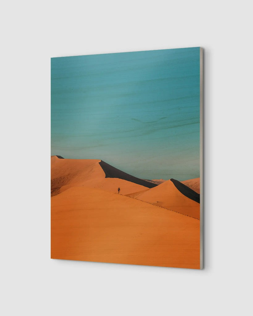 Wood print of a desert landscape showing the layered plywood edge